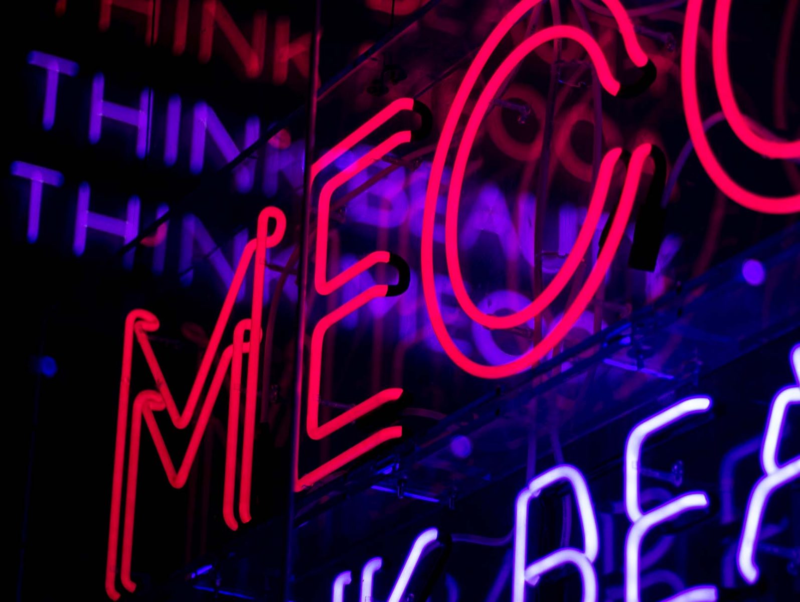 Red and purple neon 'Mecca' signs