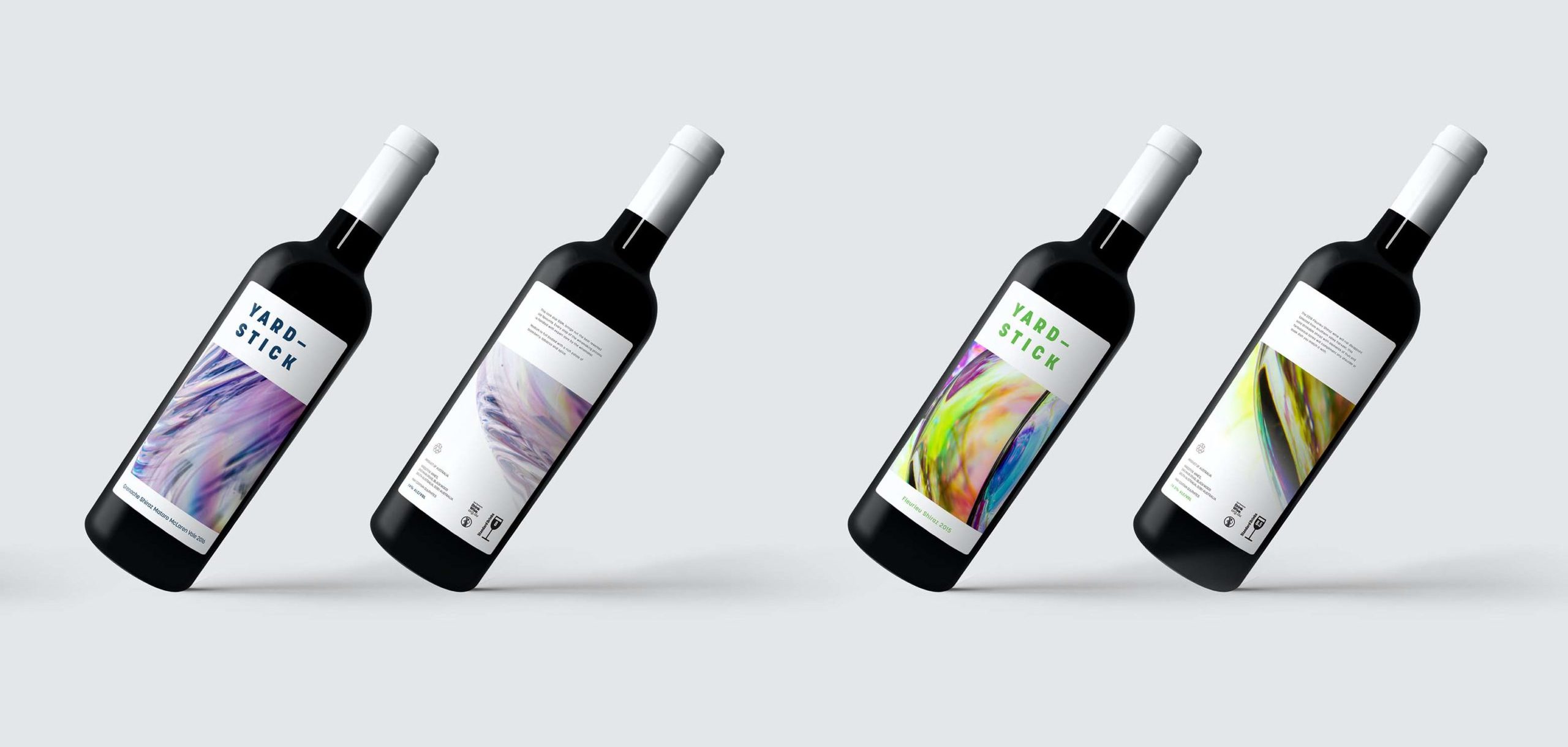 Front and back of wine bottles against a white background